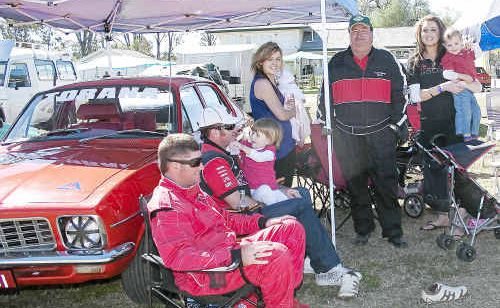 Patriarch Ty Facer (standing) with his special “pit crew”. Patriarch Ty Facer (standing) with his special “pit crew”.